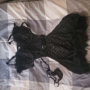 Black leopard print apron. With feathers.